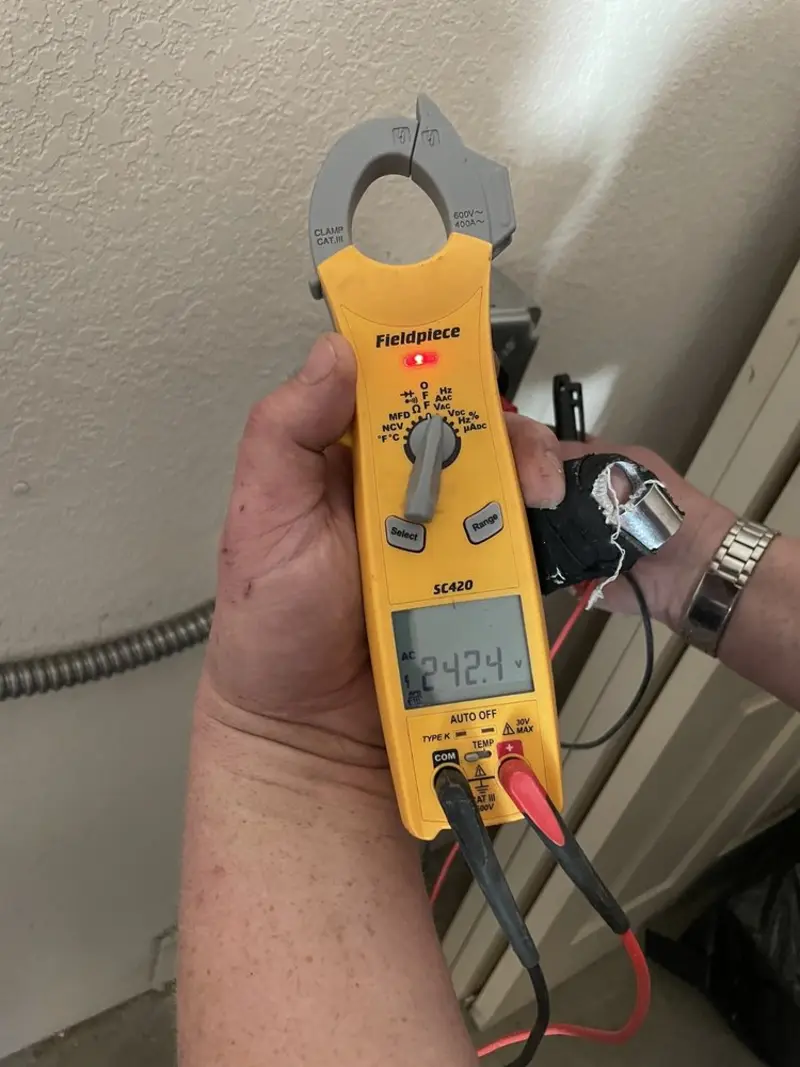 Voltage testing with clamp meter during Electrical Installation Services in Lee's Summit